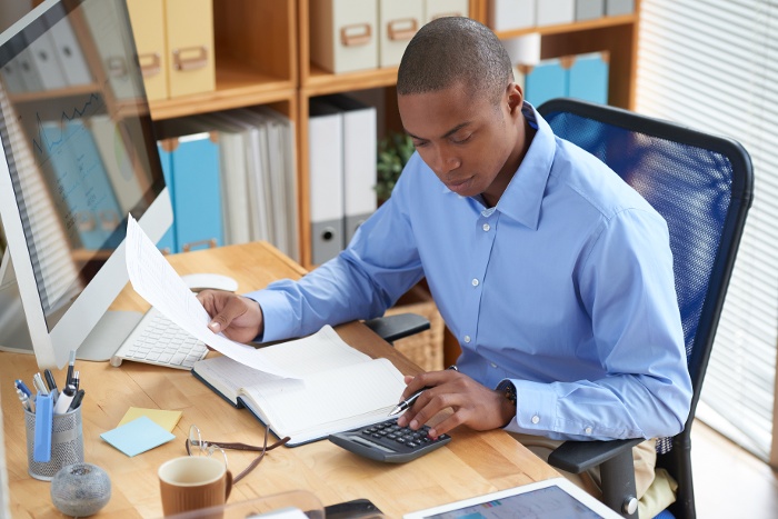 high-angle-view-male-accountant-checking-financial-document-1