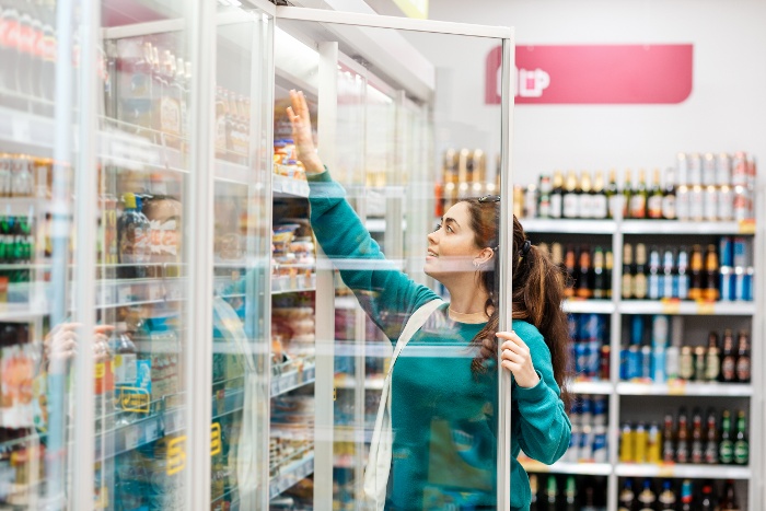 a woman shopping in the drink aisle